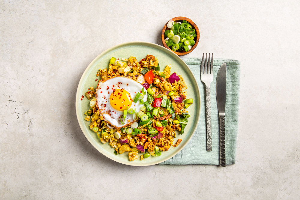 Bloemkoolrijst nasi met Oosterse wokgroenten Bloemkoolrijst nasi met Oosterse wokgroenten